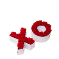 Red roses arranged in white boxes shaped as the letters 'X' and 'O', with the text 'VENUS ET FLEUR' visible on the boxes.
