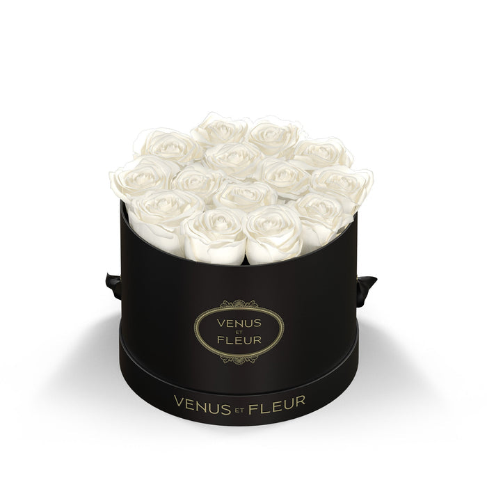 Black round box with white roses and gold text 'VENUS ET FLEUR' on the box